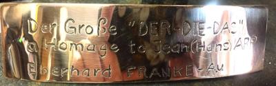 Hand etched bronze label